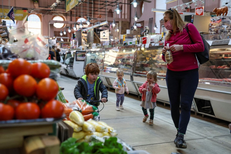 People shop at the Eastern Market in Washington, U.S., February 11, 2022.