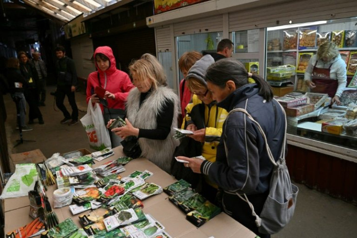 Nadia Grebenyk is doing brisk business selling seeds for watermelon, cucumbers, carrots and flowers