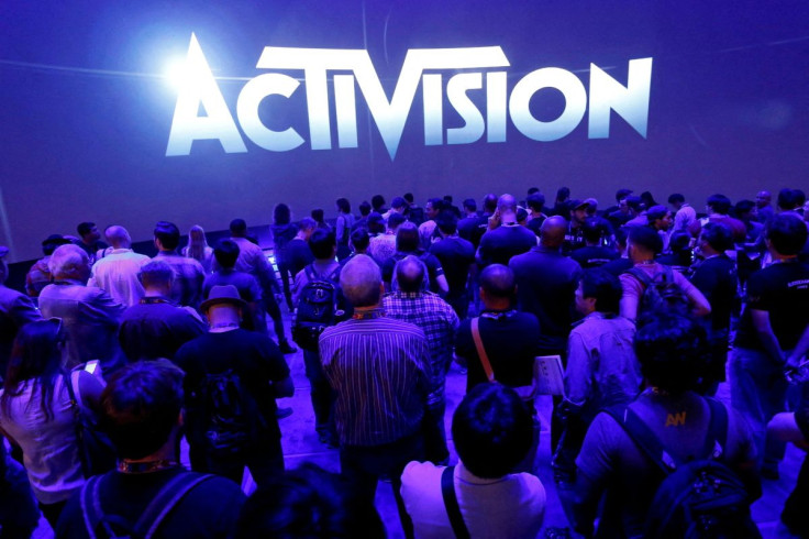A crowd waits for a video presentation at the Activision booth during the 2014 Electronic Entertainment Expo, known as E3, in Los Angeles, California June 11, 2014.  