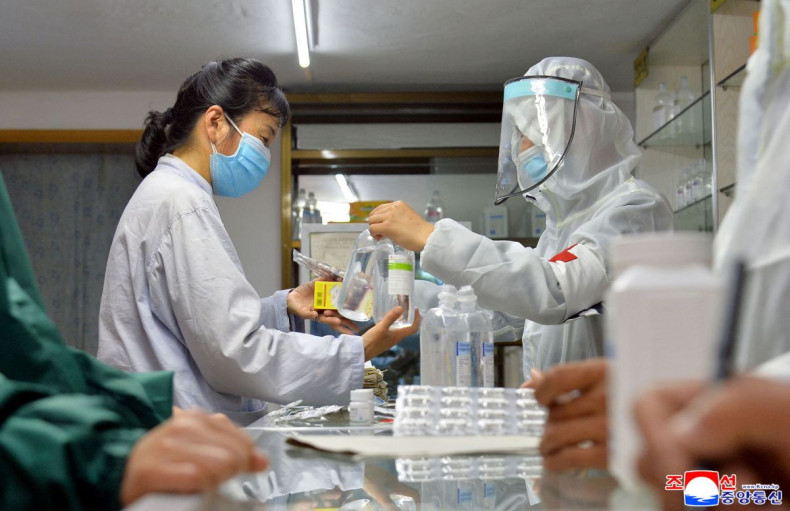 Army medics involved in medicine supply distribution work at a pharmacy amid concerns of coronavirus disease (COVID-19) spread in Pyongyang, North Korea May 22, 2022 in this photo released May 23, 2022 by the country's Korean Central News Agency.  KCNA vi