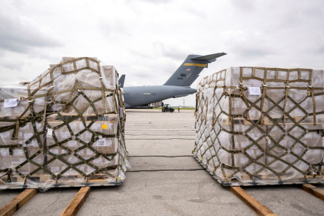 Crew members of an Air Force C-17 aircraft unload Nestle baby formula after its arrival from Ramstein Air Base in Germany, in Indianapolis, Indiana, U.S. May 22, 2022. Doug McSchooler/USA TODAY NETWORK via REUTERS 