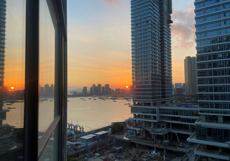 Under-construction apartments are pictured from a building during sunset in the Shekou area of Shenzhen, Guangdong province, China November 7, 2021. Picture taken November 7, 2021. 