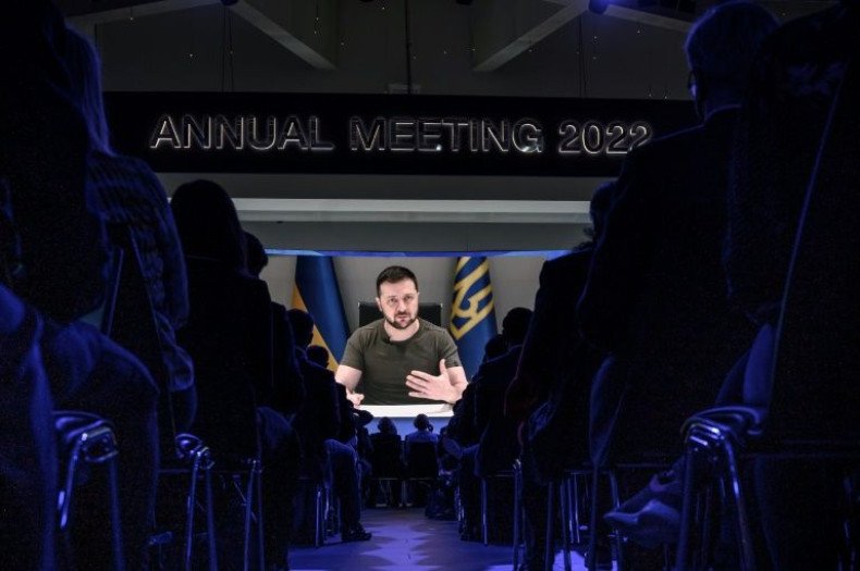 Ukrainian President Volodymyr Zelensky is seen on a giant screen during his address by video conference as part of the World Economic Forum (WEF) annual meeting in Davos