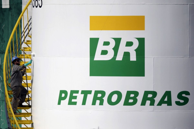 A worker paints a tank of Brazil's state-run Petrobras oil company in Brasilia, Brazil September 30, 2015. 