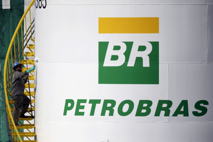 A worker paints a tank of Brazil's state-run Petrobras oil company in Brasilia, Brazil September 30, 2015.