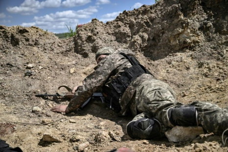 'Who can stop this war,' the Ukrainian soldier pleaded after being pinned down to the same spot for five hours by exploding Russian shells