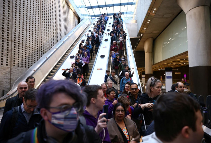The first passengers of the Elizabeth Line at Paddington travel down an escalator into the station, on the day it opens to members of the public for the first time, in London, Britain, May 24, 2022. 