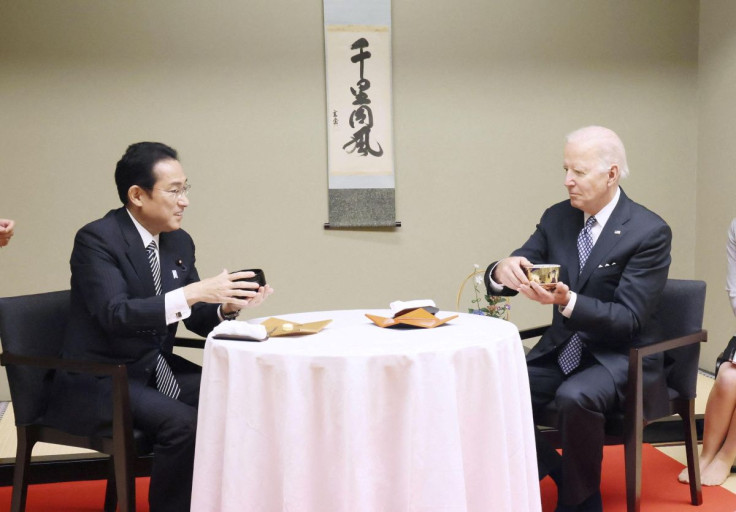 U.S. President Joe Biden experiences a traditional tea ceremony with Japan's Prime Minister Fumio Kishida during a private dinner in Tokyo, Japan May 23, 2022, in this photo released by Japan's Cabinet Public Relations Office via Kyodo.  Japan's Cabinet P