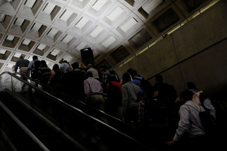 Commuters ride an escalator during the morning rush at the Metro Center subway station in Washington, U.S. June 12, 2017.  