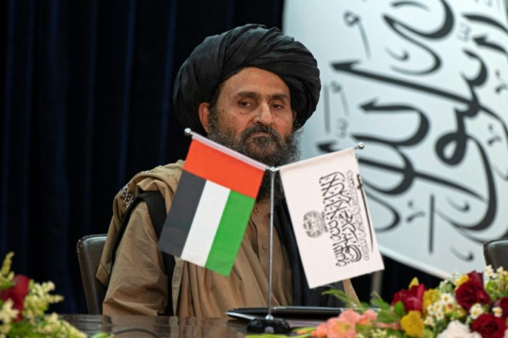 Taliban's acting first deputy prime minister Abdul Ghani Baradar attends a press conference announcing an airport deal with a UAE firm