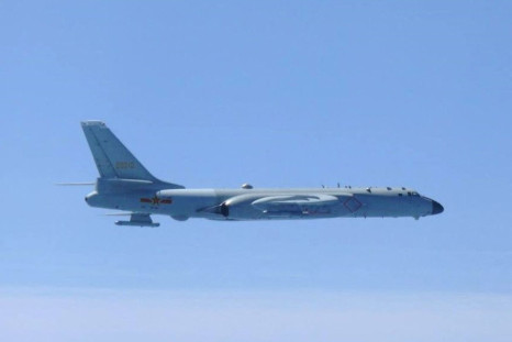 A Chinese H-6 bomber flies over East China Sea in this handout picture