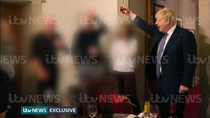 A handout picture shows British Prime Minister Boris Johnson raising a glass during a party at Downing Street, amid the coronavirus disease (COVID-19) pandemic in London, Britain November 13, 2020. Picture taken November 13, 2020. ITV News/Handout via REU