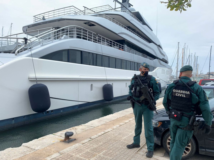 Spanish Civil Guards stand by the Tango superyacht, belonging to Russian oligarch Viktor Vekselberg, which was seized on behalf of U.S. authorities, as it is docked at the Mallorca Royal Nautical Club, in Palma de Mallorca, in the Spanish island of Mallor