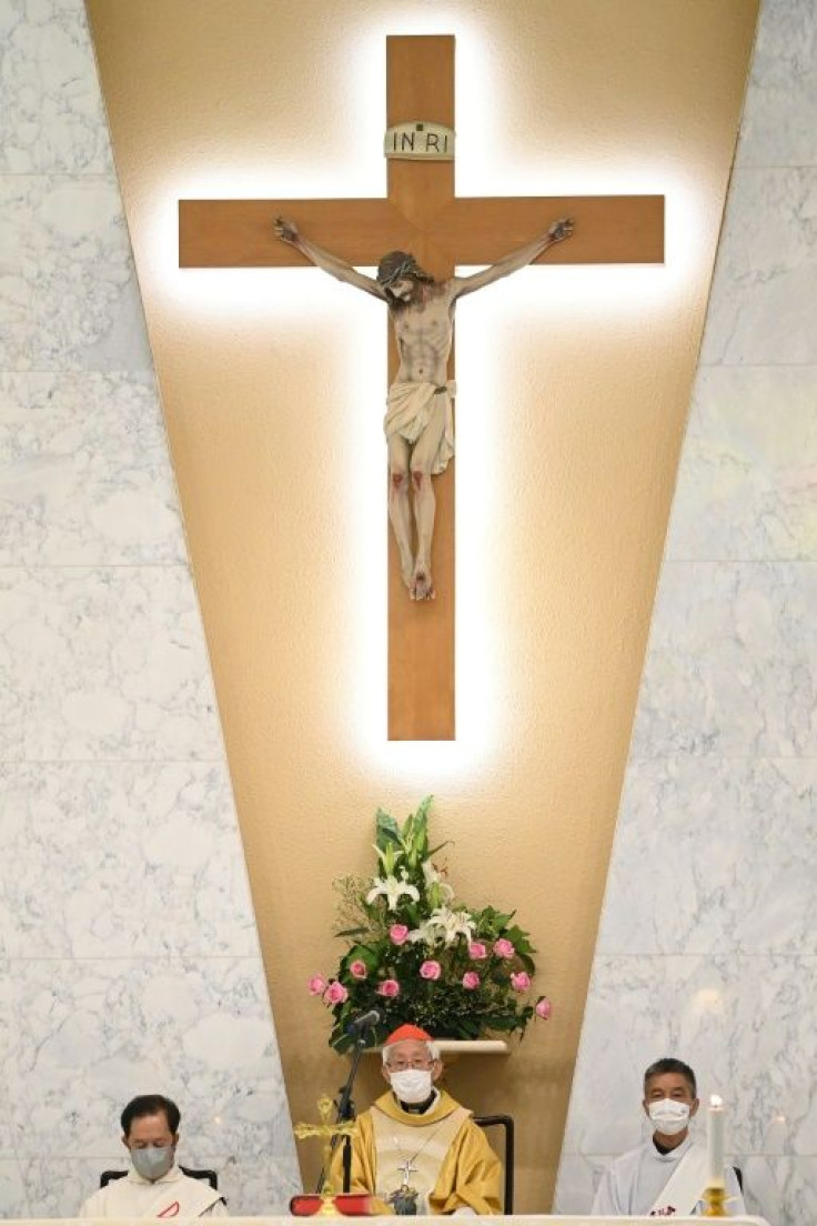 Dressed in gold robes and standing below a large effigy of Christ on the cross, Zen did not mention the case or the Hong Kong authorities directly