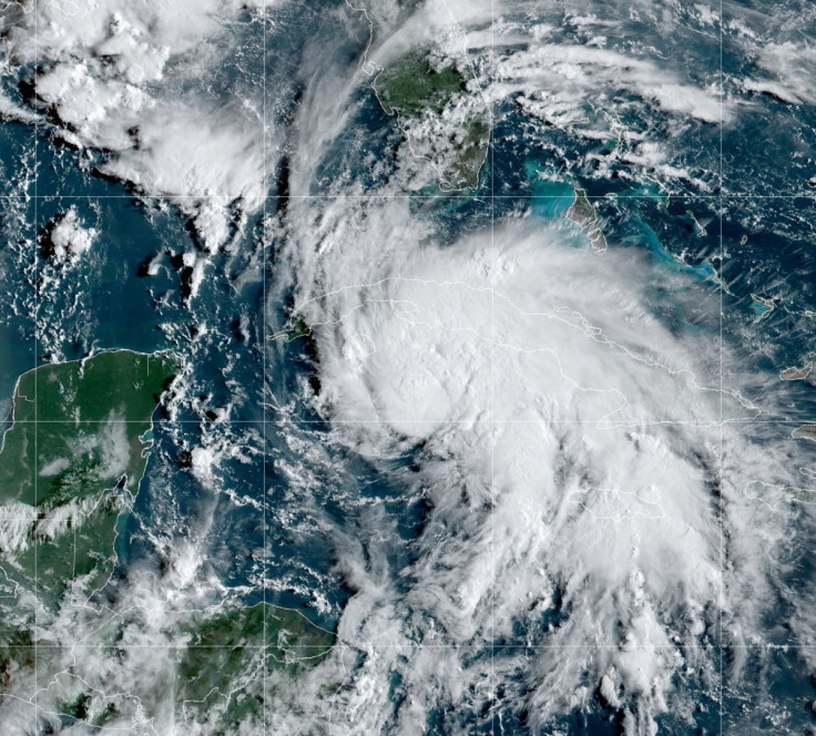 A satellite image shows Tropical Storm Ida after forming in the Caribbean, about 75 miles (125 kilometers) north-northwest of Grand Cayman, August 27, 2021. NOAA/Handout via