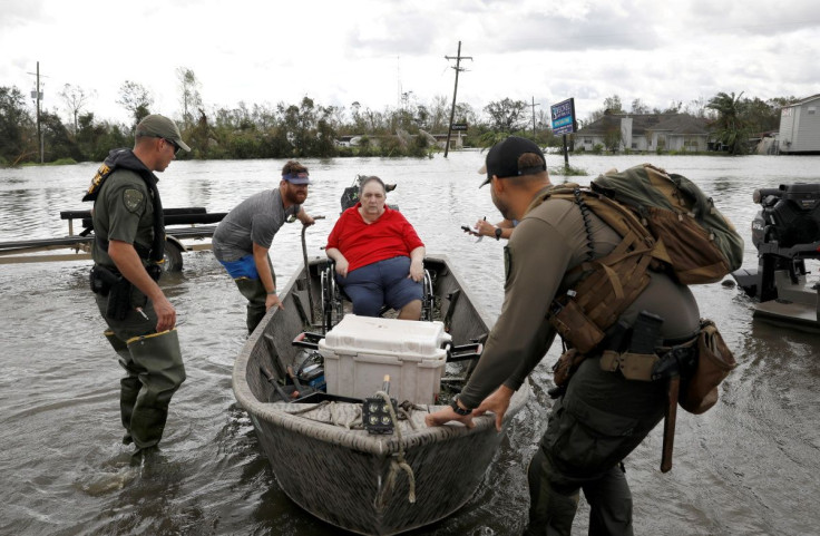 Members of a rescue team help evacuate people after Hurricane Ida made landfall in Louisiana, in Laplace, Louisiana, U.S. August 30, 2021. 