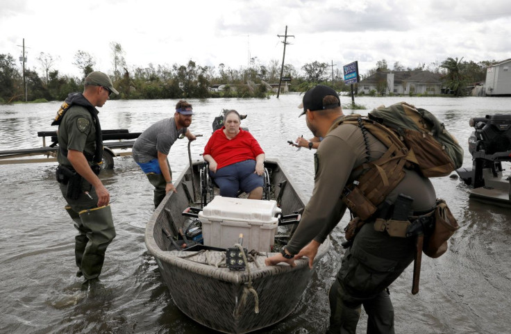 Members of a rescue team help evacuate people after Hurricane Ida made landfall in Louisiana, in Laplace, Louisiana, U.S. August 30, 2021.