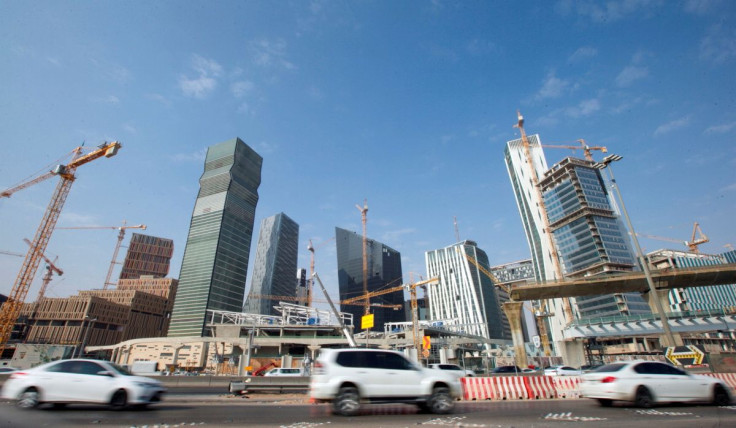 Cars drive past the King Abdullah Financial District in Riyadh, Saudi Arabia, November 12, 2017. 