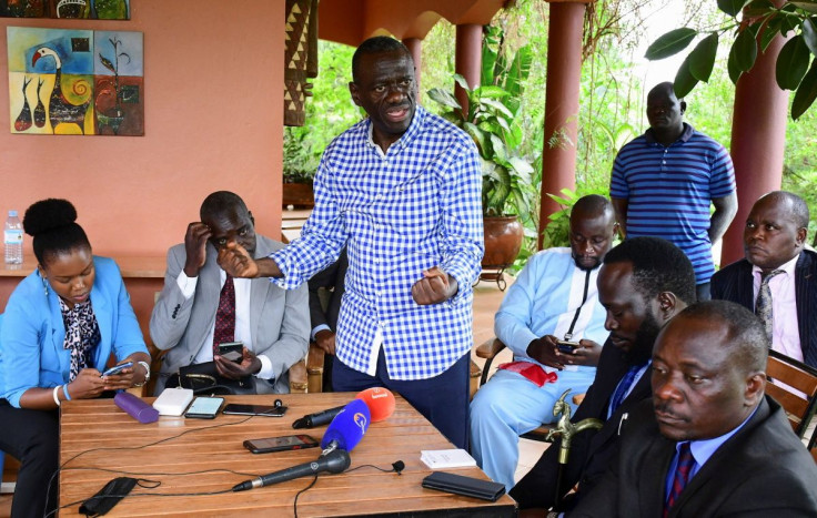 Veteran Ugandan opposition leader Kizza Besigye addresses members of opposition in parliament who visited him at his home in Kasangati, Wakiso district on the outskirts of Kampala, Uganda May 17, 2022. 