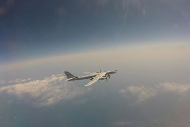 Russian Tu-95 strategic bomber flies during Russian-Chinese military aerial exercises to patrol the Asia-Pacific region, at an unidentified location, in this still image taken from a video released May 24, 2022. Russian Defence Ministry/Handout via REUTER