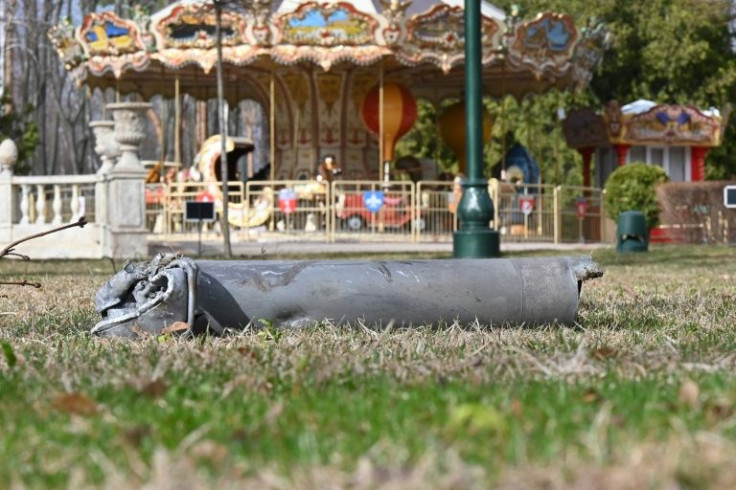 A fragment of a Russian shell next to a children's carousel
