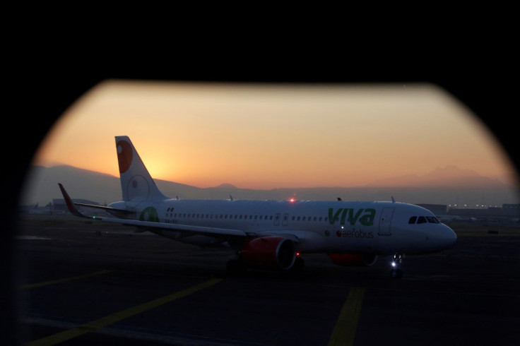A VivaAerobus aircraft sits on the tarmac as seen from inside another plane, at Benito Juarez international airport in Mexico City, Mexico February 15, 2019.