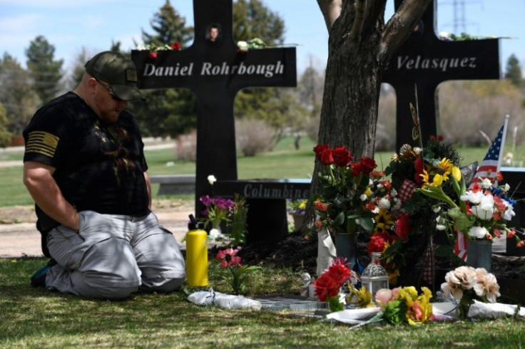 A man visits the memorial for victims of the 1999 Columbine High School shooting at the Chapel Hill Memorial Gardens in Littleton, Colorado in April 2019