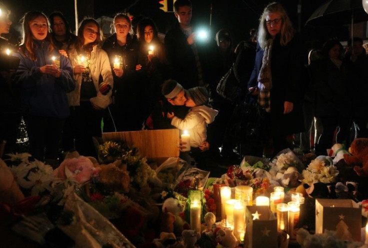 New London, Connecticut residents attend a memorial on December 16, 2012 for victims of the Sandy Hook Elementary School shooting