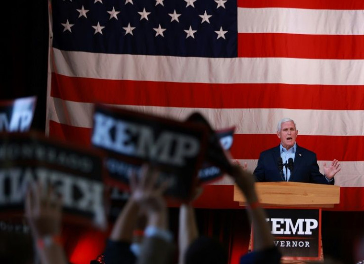 Former vice president Mike Pence, at an election eve campaign event for Georgia Governor Brian Kemp -- Pence's support for a candidate Donald Trump reviles highlights the party's internal tug of war over its future directionÂ 
