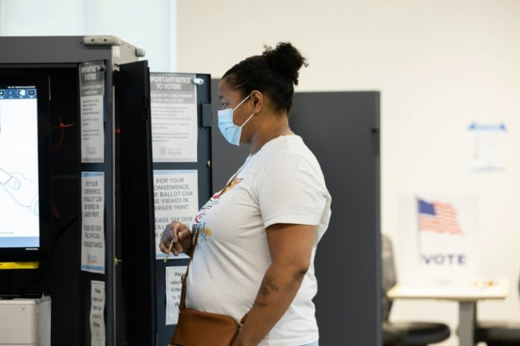 A voter casts a ballot at a polling station in Atlanta, Georgia, where former president Donald Trump's role as Republican kingmaker is being tested