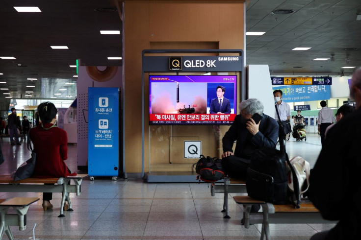 People watch a TV broadcasting a news report on North Korea's launch of three missiles what appeared to have involved an intercontinental ballistic missile (ICBM), in Seoul, South Korea, May 25, 2022.     