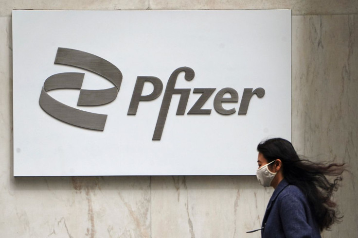 A person walks past a Pfizer logo amid the coronavirus disease (COVID-19) pandemic in the Manhattan borough of New York City, New York, U.S., April 1, 2021. 