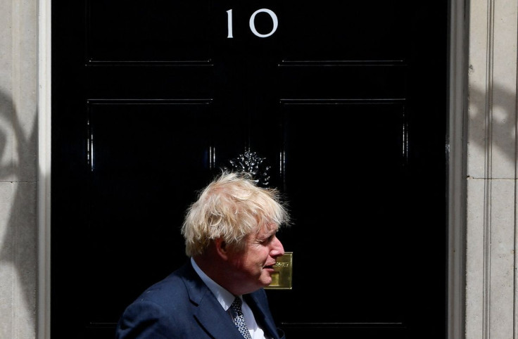 British Prime Minister Boris Johnson awaits the Qatar's Emir Sheikh Tamim bin Hamad al Thani at Downing Street in London, Britain May 24, 2022. 