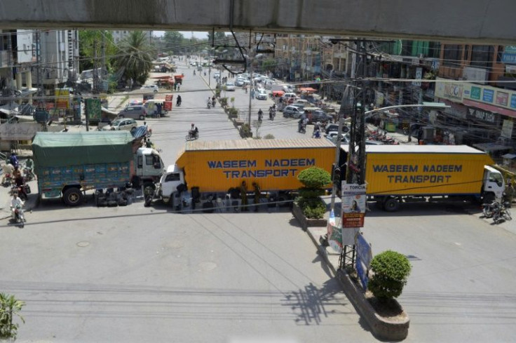 Trucks placed by authorities block a road in Rawalpindi