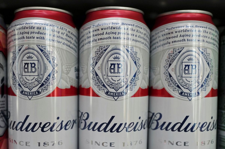 Cans of Budweiser beer are displayed on a supermarket shelf in Shanghai, China February 24, 2022. 