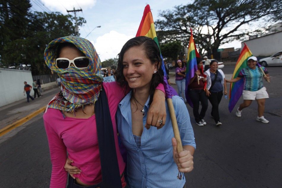 Two women take part in the quotMarch of Bitchesquot to protest against discrimination and violence against women in Tegucigalpa