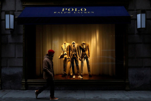A man walks past Ralph Lauren Corp.'s flagship Polo store on Fifth Avenue in New York City, U.S., April 4, 2017.    