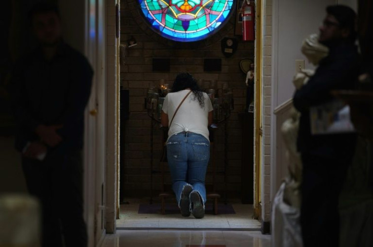 Catholic faithful attend a Mass at Sacred Heart Catholic Church in Uvalde Texas, one day after a gunman opened fire at Robb Elementary school