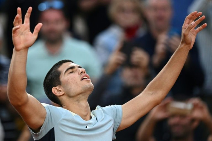 Relief: Carlos Alcaraz celebrates his five-set win over Albert-Ramos Vinolas