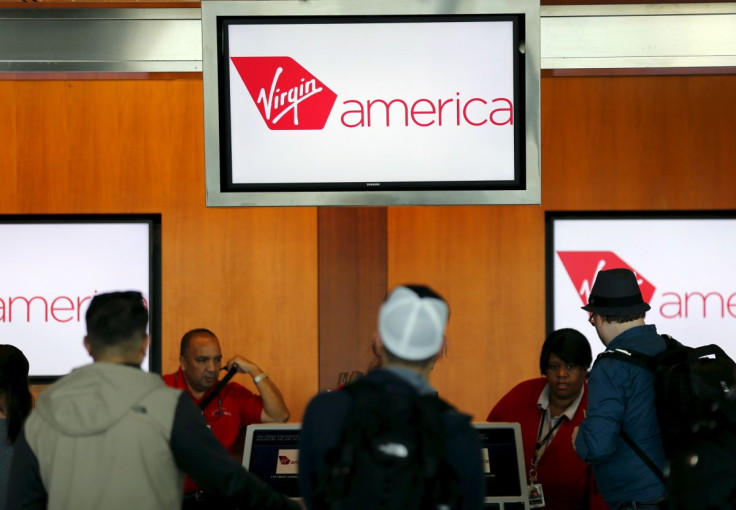 Passengers check in for their flights at the Virgin America ticket counter in San Diego, California April 4, 2016.  