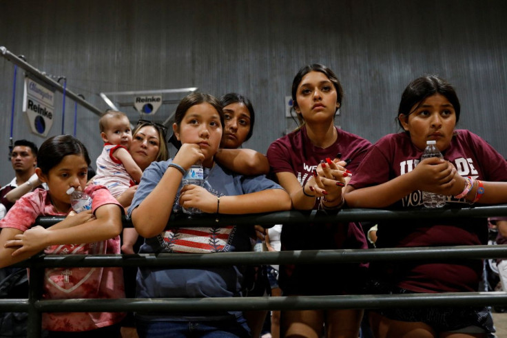 Children react during a vigil at Uvalde County Fairplex Arena, in Uvalde, Texas, U.S. May 25, 2022. 