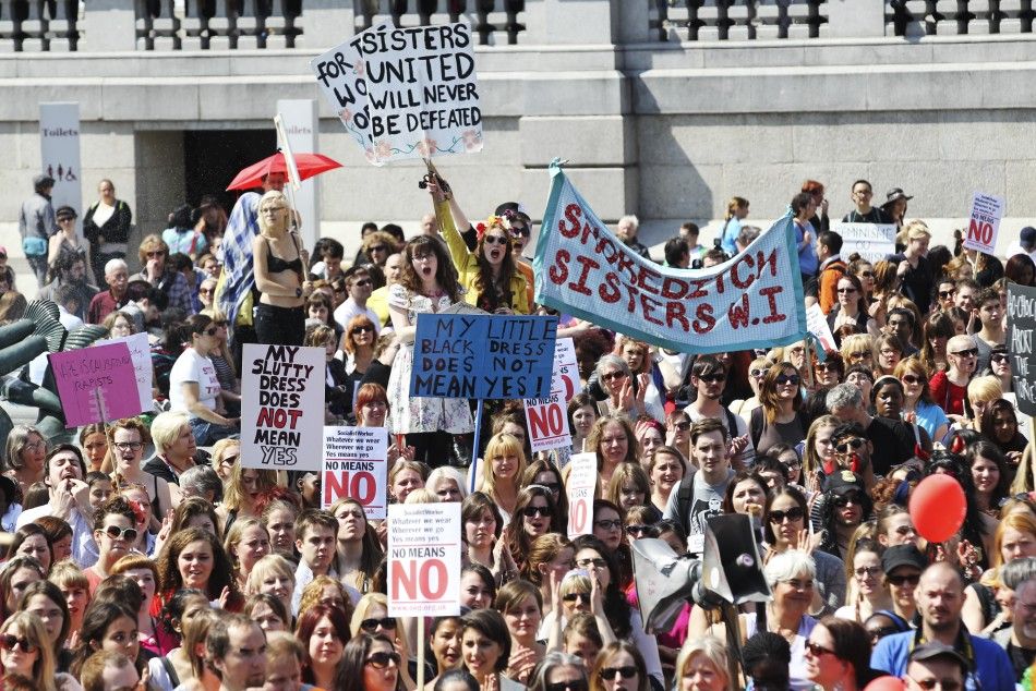 SlutWalk participants cheer a speaker, after walking from Hyde Park Corner, in Trafalgar Square, central London