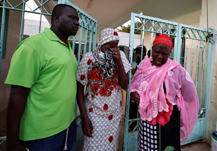 Kaba, a mother of a ten-day-old baby, reacts as she walks out of the hospital, where newborn babies died in a fire at the neonatal section of a regional hospital in Tivaouane, Senegal, May 26, 2022. 