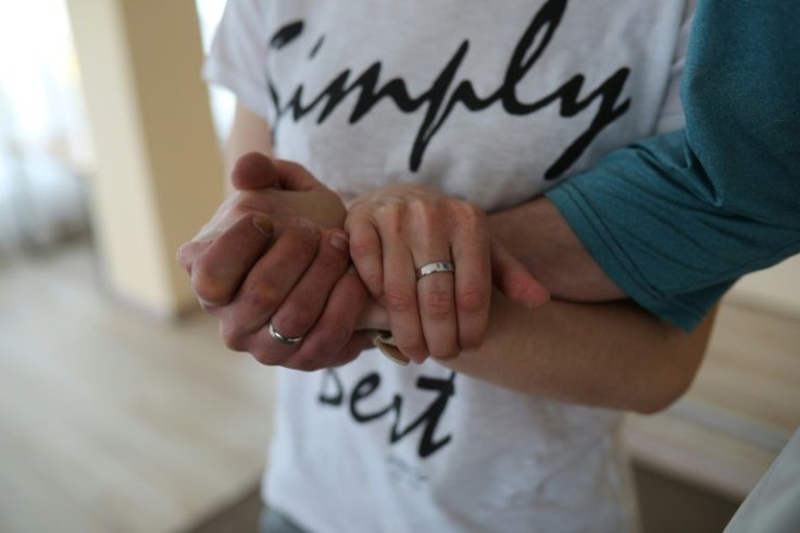 Ivan Khvatov, 39, and Olesya Khvatova, 41, wore jeans and trainers to Wednesday's wedding ceremony, which was over in minutes