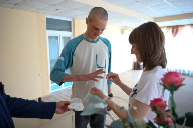 The couple, who met at a glassware factory where they work, had been due to marry on March 17, but Khvatova fled when the war began