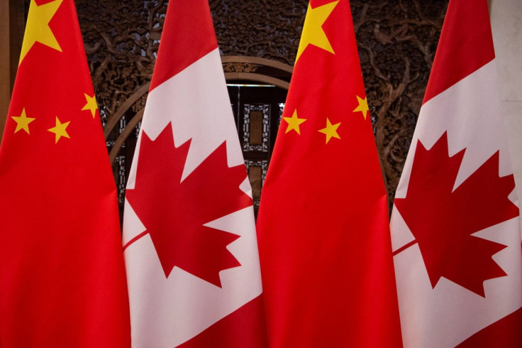 Picture of Canadian and Chinese flags taken prior to the meeting with Canada's Prime Minister Justin Trudeau and China's President Xi Jinping at the Diaoyutai State Guesthouse on December 5, 2017, in Beijing. Picture taken December 5, 2017. Fred Dufour/Po