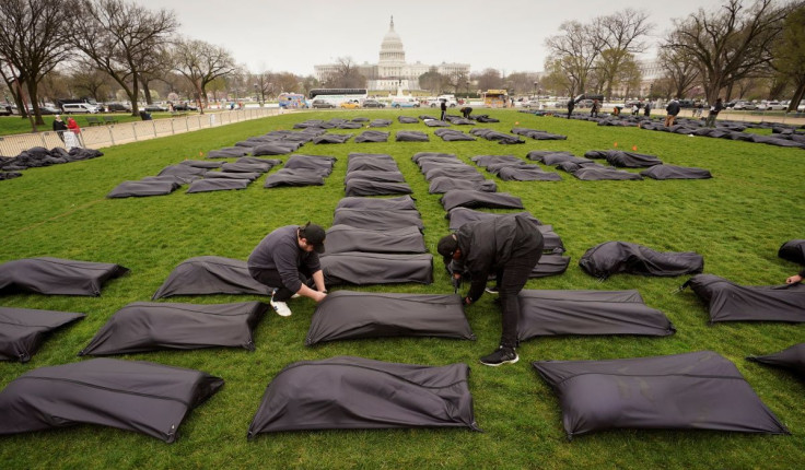 Some of the 1,100 body bags that will spell out the words âThoughts and Prayersâ are placed on the National Mall near the U.S. Capitol as gun control activists demand Congress do more to end gun violence in Washington, U.S., March 24, 2022. 