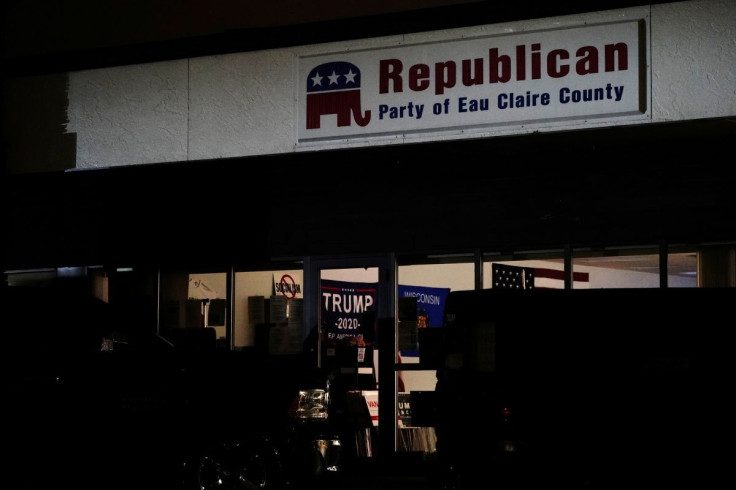 Signs and flags supporting U.S. President Donald Trump are seen inside the Republican Party of Eau Claire County office during a âMAGA meetupâ presidential debate watch party in Altoona, Wisconsin, U.S., October 22, 2020. 