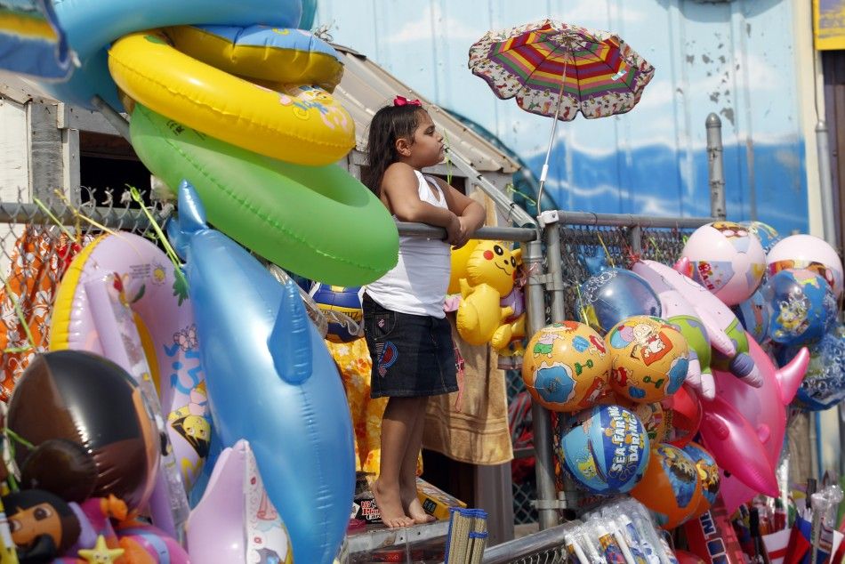 A girl watches the Mermaid Parade at Coney Island in the Brooklyn section of New York