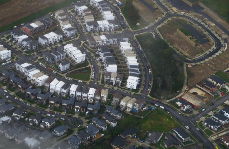 A newly built housing estate can be seen next to another under construction in a suburb of Auckland in New Zealand, June 24, 2017. 